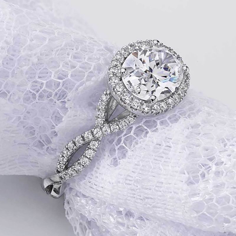 Oval Cut Diamond Spiral Engagement Ring with Halo